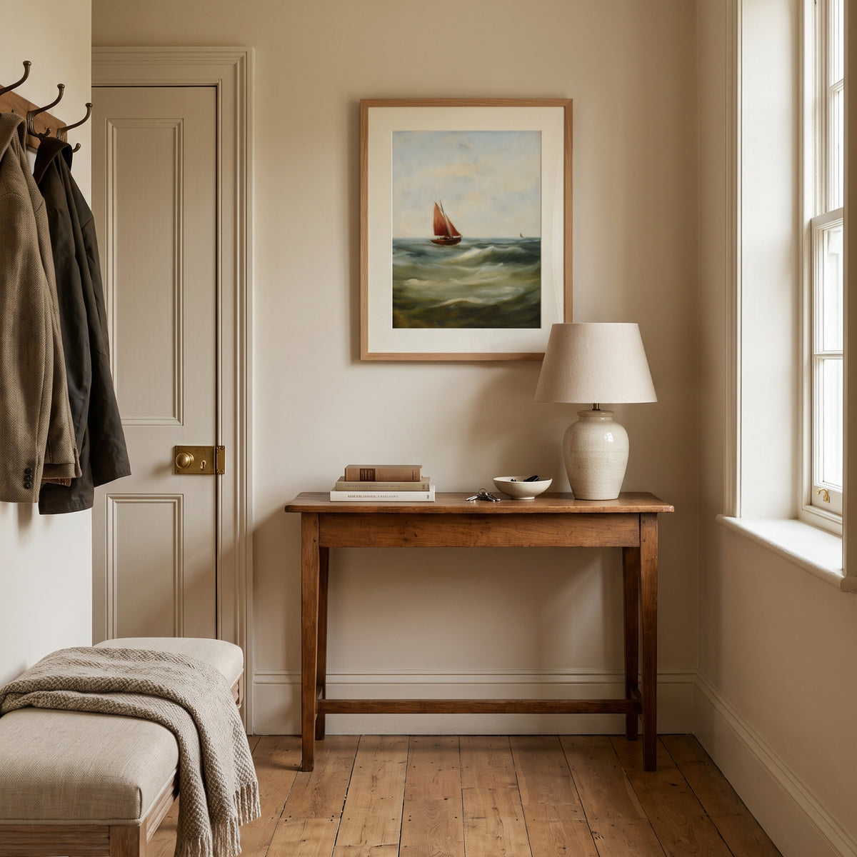 Sailing Boat, No. 1 – coastal art print in dark red and olive green in neutral hallway above console table
